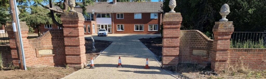 This is a photo of a newly installed chip and tar driveway, installed by Mildenhall Driveways